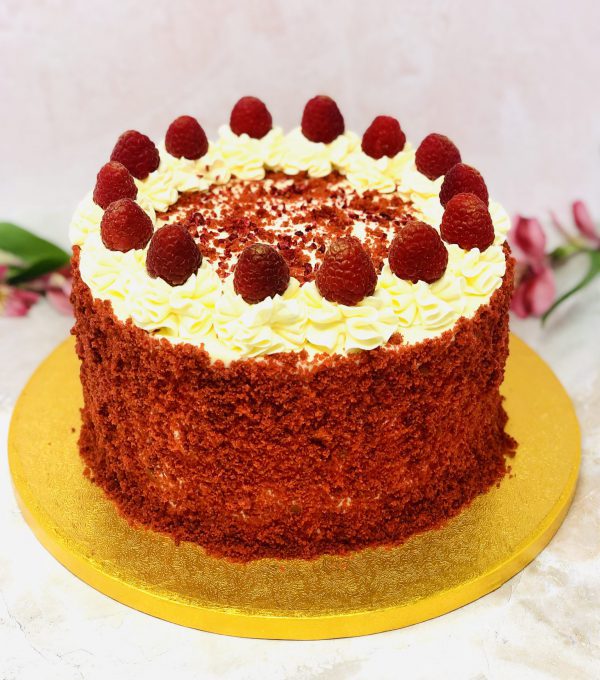 Unique handcrafted luxury red velvet birthday cake with cream cheese and strawberries