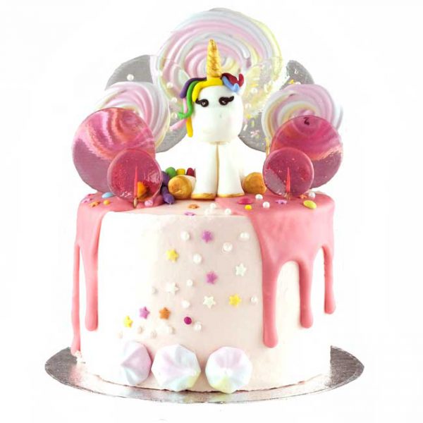 Magical children's celebration cake with unicorn and lollipops