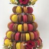 Colourful freshly baked 5-tier tower of French macarons