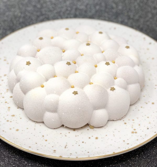 Unique handmade white Christmas cloud cake topped with stars