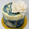 Unique bespoke blue and white swirl sparkle galaxy cake with flower