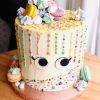 Rainbow sprinkle drip macaroon meringue cake