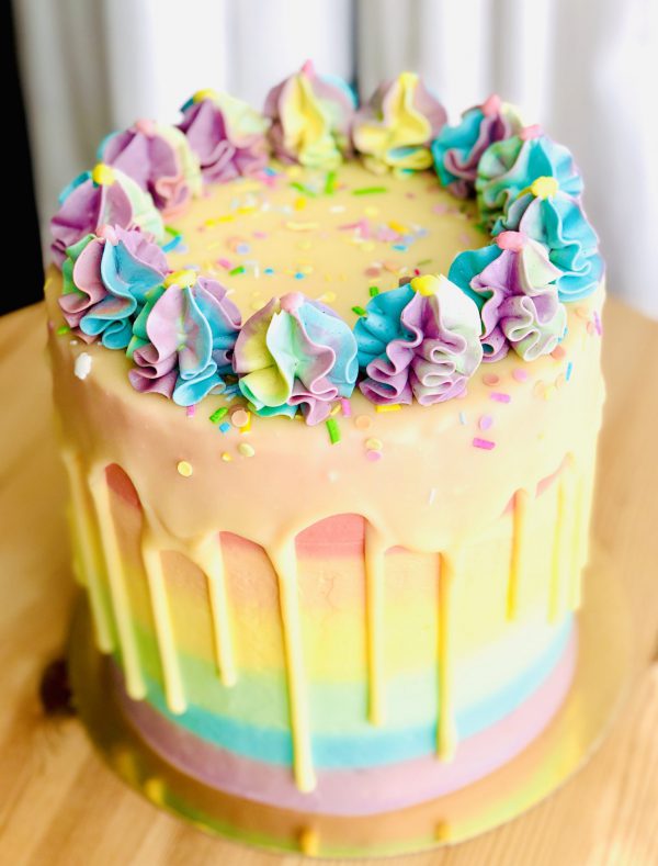 Beautiful rainbow childrens birthday pinata cake