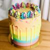 Unique colourful birthday pinata cake with vanilla drip
