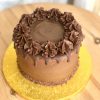 Chocolate icing on decadent celebration cake with drip topping and chocolate ganache