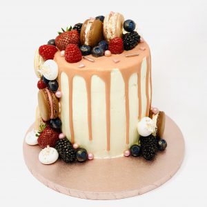 Peach and Prosecco handmade birthday cake with fruits and drip detail